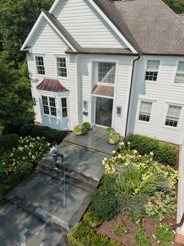 Overhead drone photo of paver walkway cleaning in progress