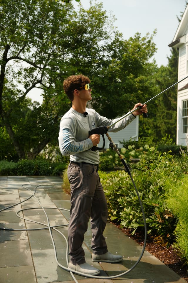 Rinsing a stone patio and walkway