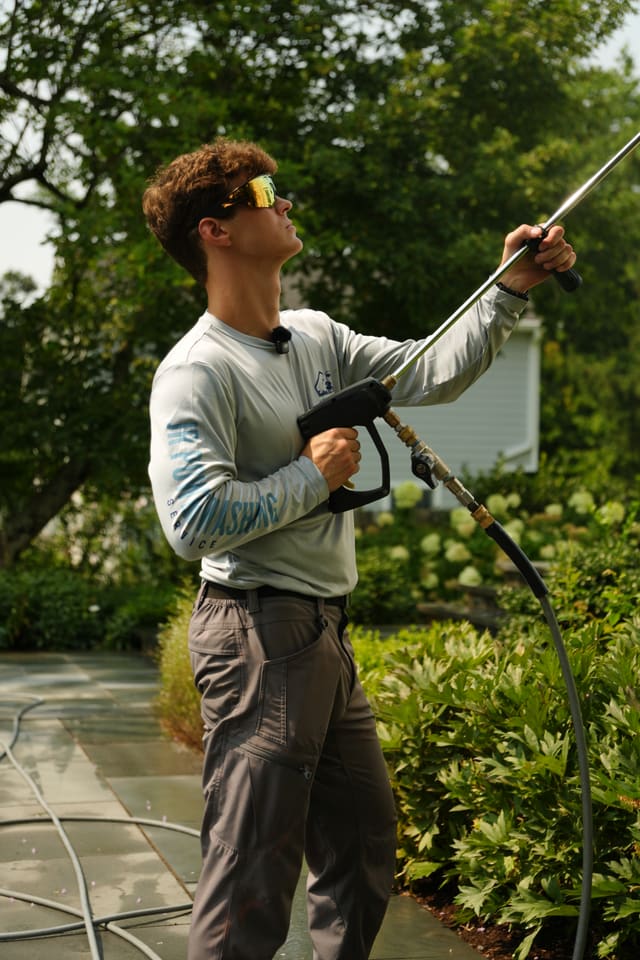 Reaching the second storey of a home with a soft wash wand